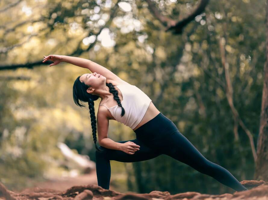 Woman performing a yoga position on a mat