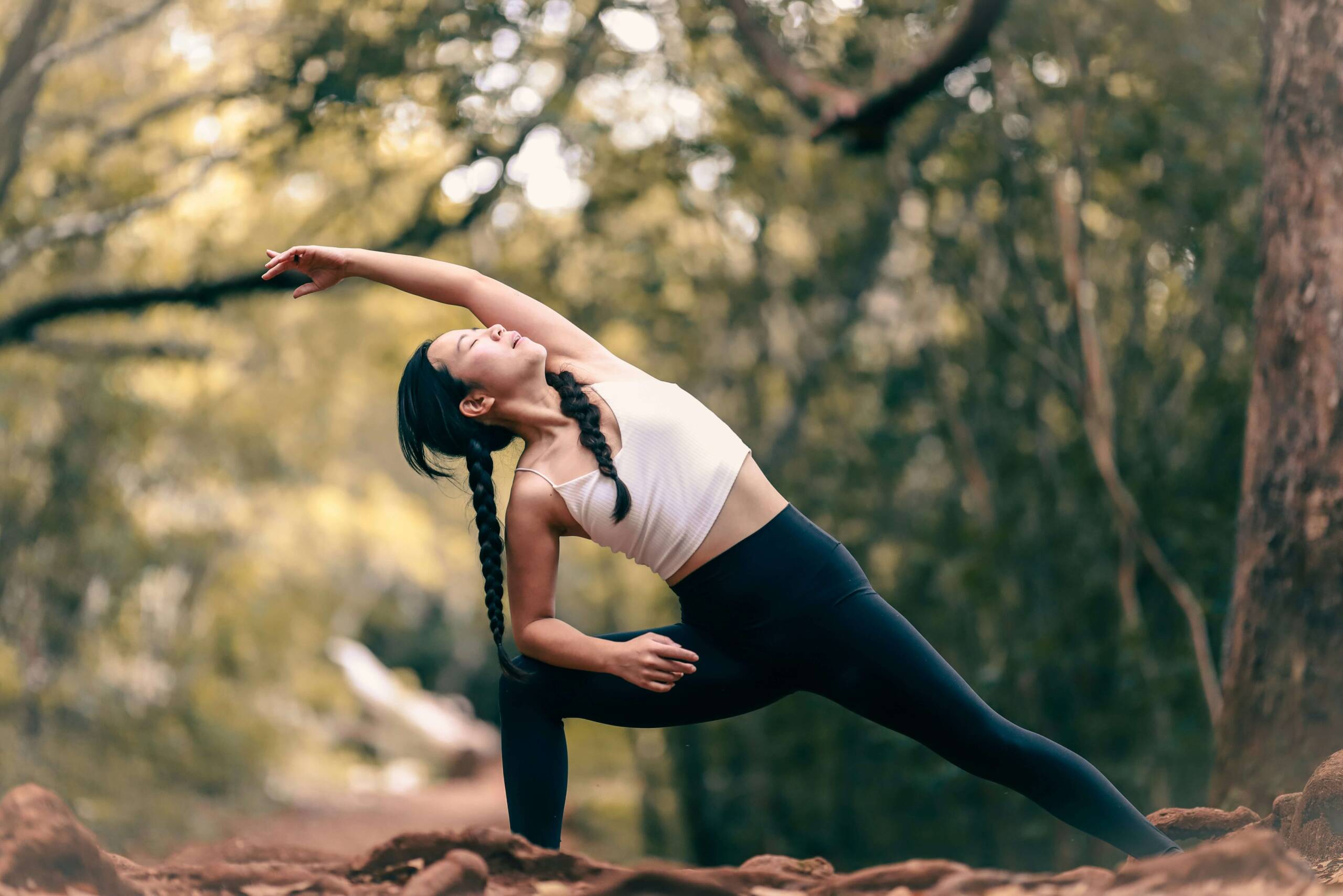 Woman performing a yoga position on a mat