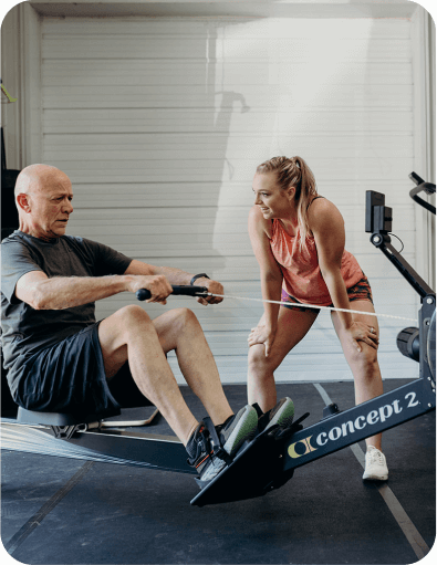 Personal Trainer in Buncombe County assisting a client