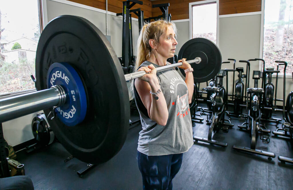 24 hour access gym. women in her 50 working out