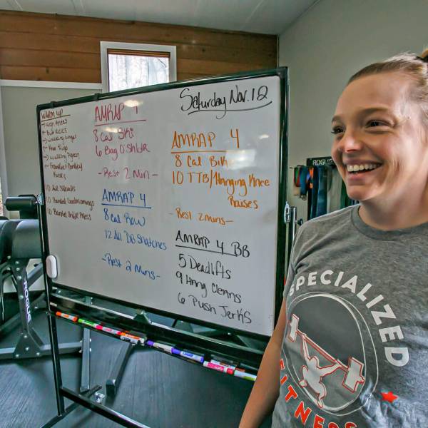 Nutrition and feeding instructor in front of a board